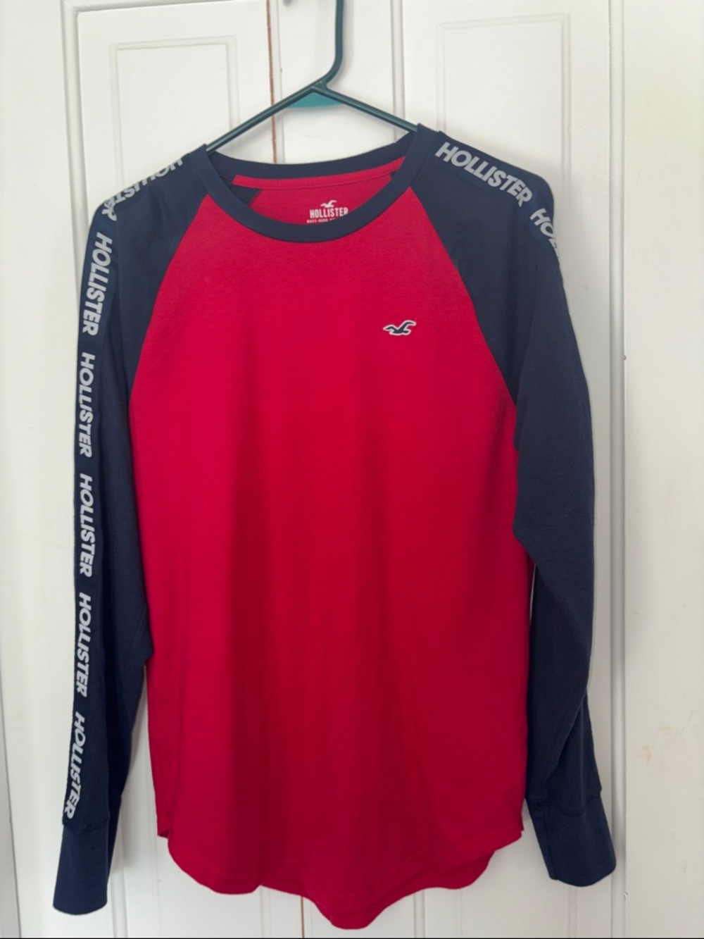Hollister Red Raglan Long Sleeve Tee with Navy Sleeves with logo.